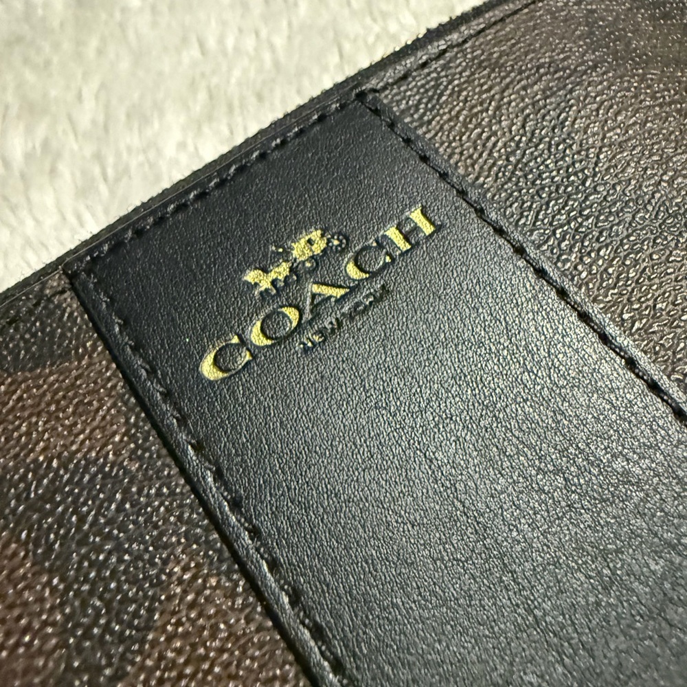 Coach Black and Brown and Coach white and gold leather wristlets